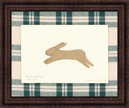 Framed Jumping Bunny. Frame: Florence Walnut. Paper: Rag Paper. Art Size: 12x15. Final Size: 14'' X 17''