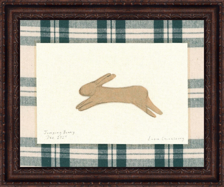 Framed Jumping Bunny. Frame: Florence Walnut. Paper: Rag Paper. Art Size: 12x15. Final Size: 14'' X 17''